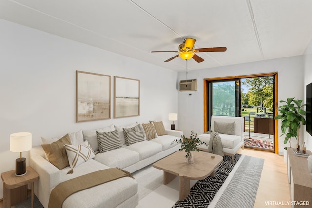 living room featuring a wall mounted air conditioner, ceiling fan, and light hardwood / wood-style floors