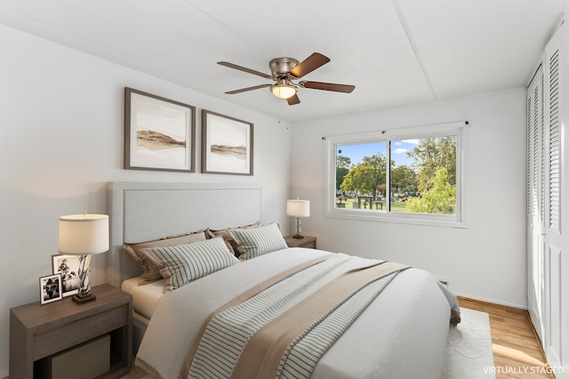 bedroom featuring ceiling fan and light hardwood / wood-style flooring