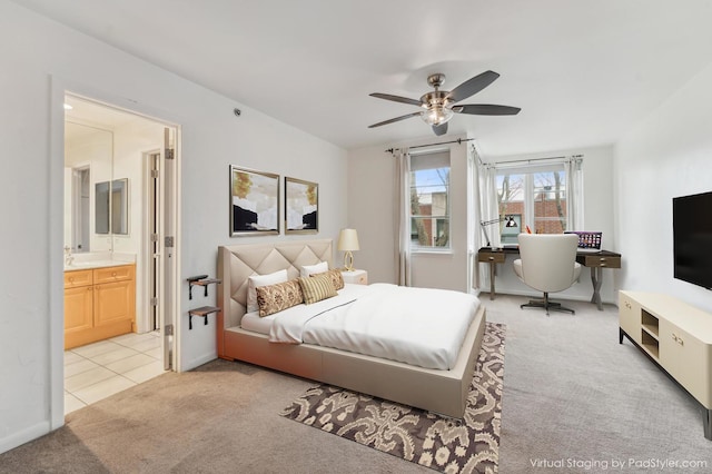 carpeted bedroom with connected bathroom and ceiling fan