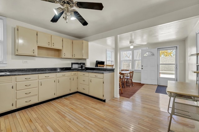 kitchen with ceiling fan, light hardwood / wood-style flooring, and cream cabinetry