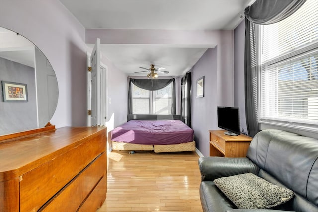 bedroom featuring ceiling fan and light hardwood / wood-style floors