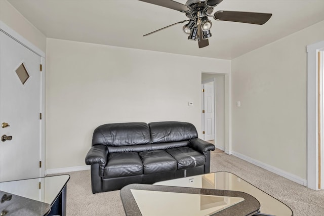 living room featuring carpet flooring and ceiling fan