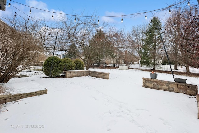 view of yard layered in snow