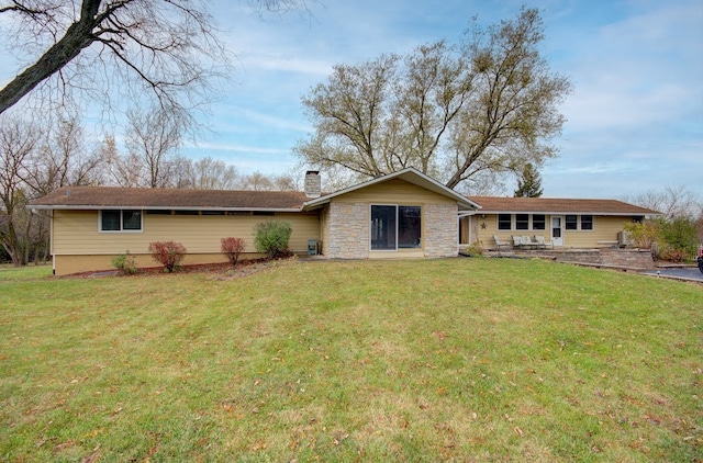 back of house with a yard