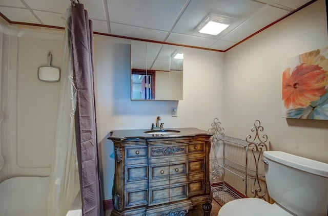 bathroom featuring a paneled ceiling, vanity, and toilet