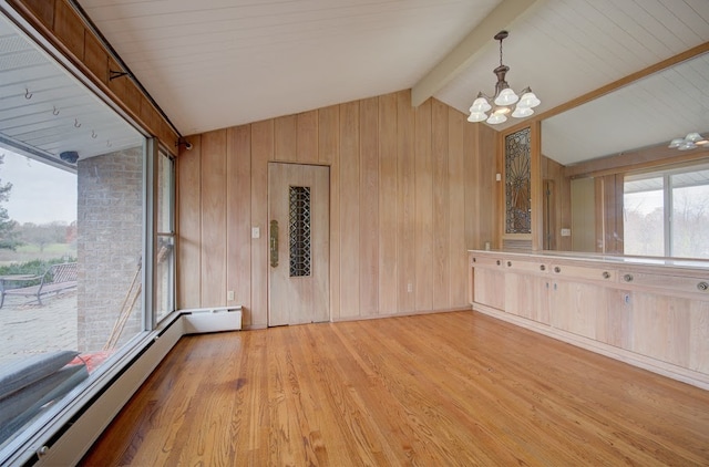 interior space with wooden walls, vaulted ceiling with beams, light wood-type flooring, a baseboard radiator, and a chandelier