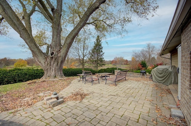 view of patio / terrace with a fire pit