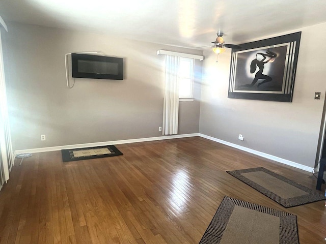 empty room featuring hardwood / wood-style floors and ceiling fan