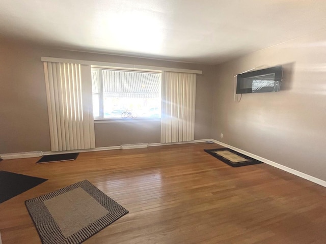 empty room featuring hardwood / wood-style floors