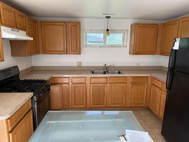 1402 Berkeley Ave, Chicago Heights, IL 60411 - kitchen featuring under cabinet range hood, black appliances, light countertops, and brown cabinets