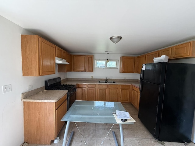 1402 Berkeley Ave, Chicago Heights, IL 60411 - kitchen with black appliances, under cabinet range hood, light countertops, and light tile patterned floors