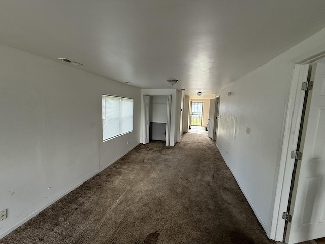 1402 Berkeley Ave, Chicago Heights, IL 60411 - unfurnished living room with carpet flooring and baseboards