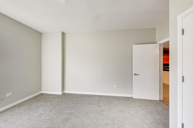 unfurnished room with carpet flooring