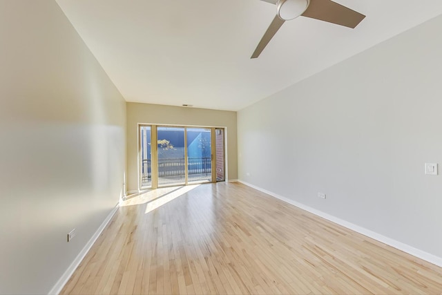 empty room featuring light wood-type flooring and ceiling fan