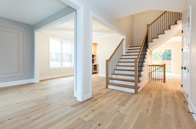 entrance foyer featuring light hardwood / wood-style floors and a wealth of natural light