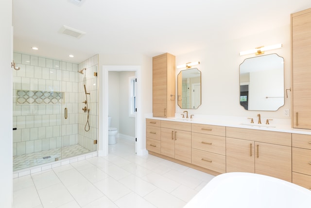 full bathroom with shower with separate bathtub, vanity, toilet, and tile patterned floors