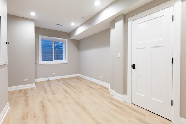 basement featuring light hardwood / wood-style flooring