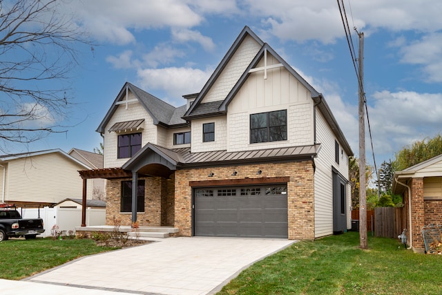 view of front of house featuring a garage and a front lawn