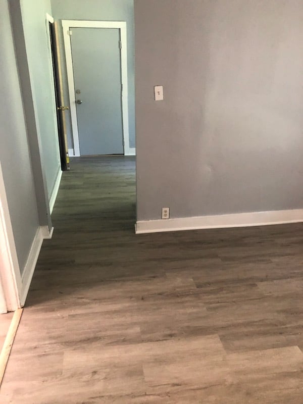 hall with dark hardwood / wood-style flooring