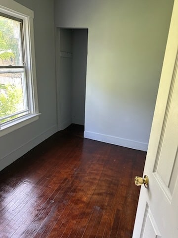 empty room featuring dark hardwood / wood-style floors