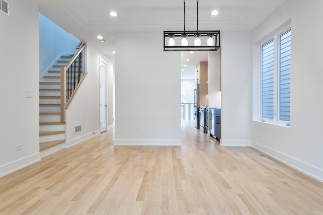 unfurnished dining area with light hardwood / wood-style flooring