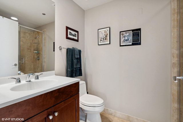 bathroom featuring tile patterned flooring, vanity, toilet, and a shower with shower door