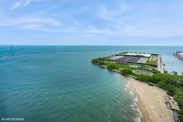 bird's eye view with a water view and a beach view