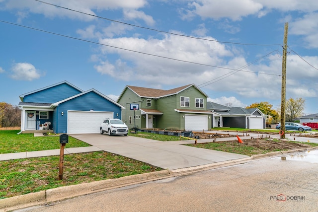 view of front of home with a garage and a front lawn