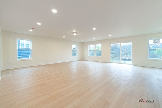 spare room featuring light hardwood / wood-style floors