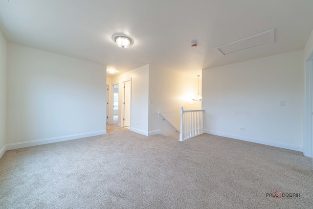 empty room with light colored carpet