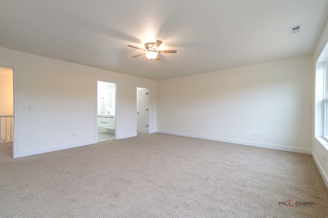 carpeted empty room with ceiling fan