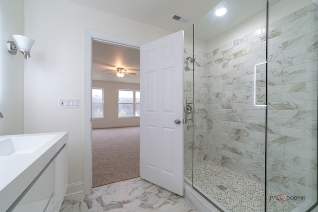 bathroom with vanity, an enclosed shower, and ceiling fan