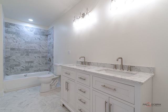 full bathroom with vanity, toilet, and tiled shower / bath