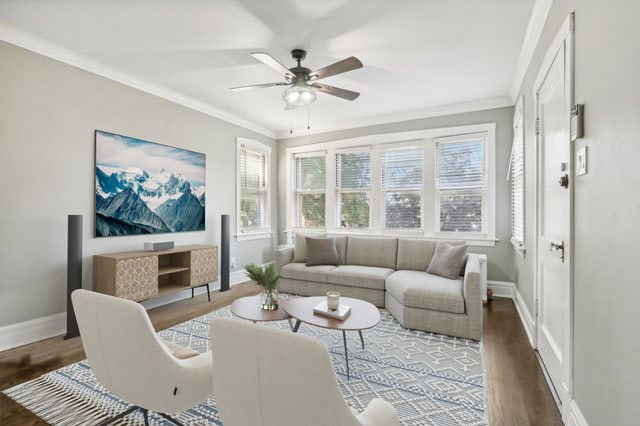 living room with ceiling fan, crown molding, and dark hardwood / wood-style floors