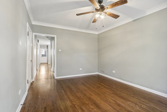 spare room with dark hardwood / wood-style floors, ceiling fan, and crown molding