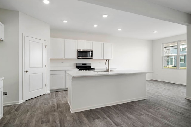 kitchen with sink, white cabinets, and stainless steel appliances