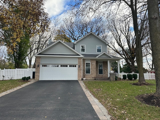 view of front of house with a front lawn, a porch, and a garage