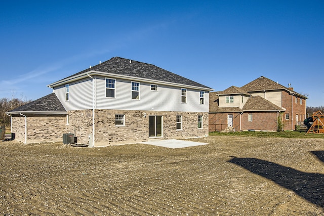 back of property featuring cooling unit and a patio