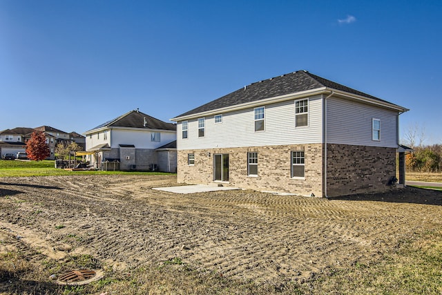 back of house with a patio area