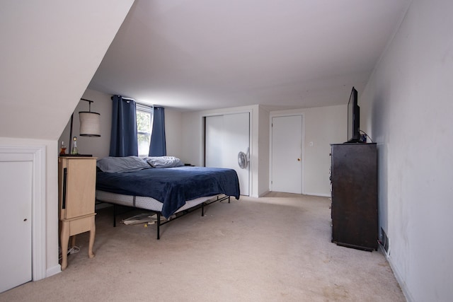 bedroom featuring light carpet