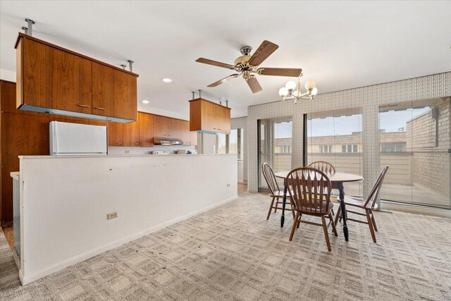 1730 W Galena Blvd Unit 402E, Aurora, IL 60506 - dining room featuring plenty of natural light, a ceiling fan, a chandelier, baseboards, and recessed lighting