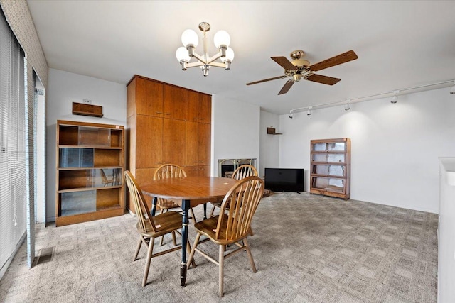 1730 W Galena Blvd Unit 402E, Aurora, IL 60506 - dining room featuring rail lighting, a chandelier, light carpet, and ceiling fan