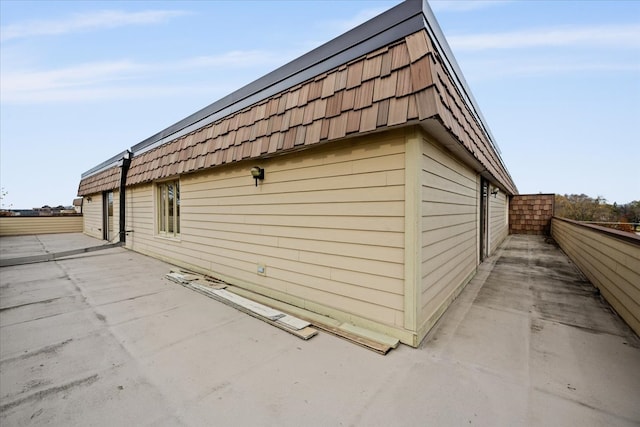 1730 W Galena Blvd Unit 402E, Aurora, IL 60506 - view of side of home featuring a patio area