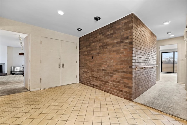 1730 W Galena Blvd Unit 402E, Aurora, IL 60506 - interior space featuring light carpet and brick wall