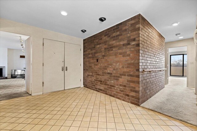 1730 W Galena Blvd Unit 402E, Aurora, IL 60506 - unfurnished room with brick wall and light carpet