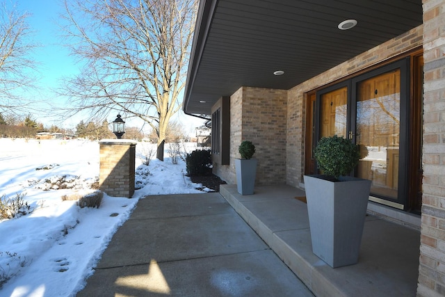 view of snow covered patio