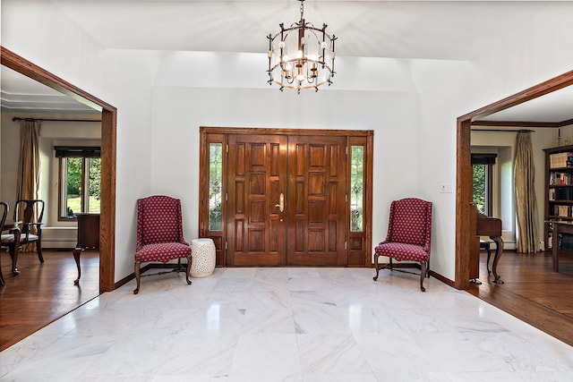 foyer featuring an inviting chandelier