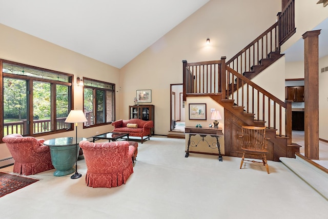 living room with decorative columns, a baseboard heating unit, carpet flooring, and high vaulted ceiling