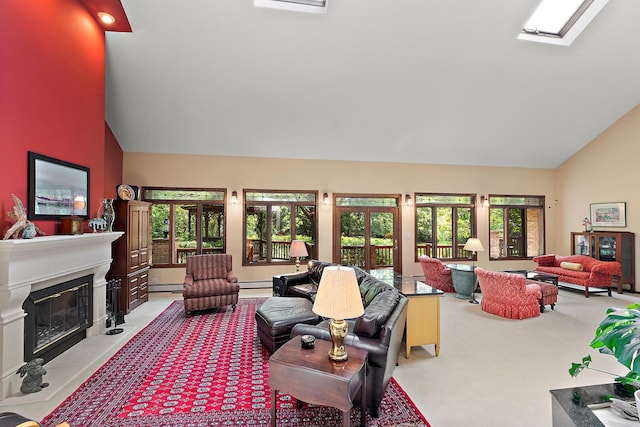 carpeted living room with baseboard heating, a skylight, and high vaulted ceiling