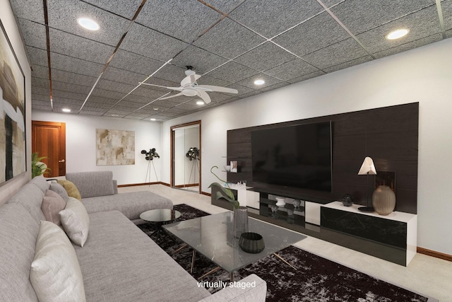 living room featuring ceiling fan, a paneled ceiling, and carpet flooring